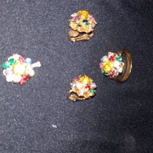 Women's set, ring, clip earrings and piece that goes on necklace.